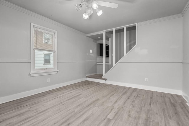 spare room with crown molding, ceiling fan, and light hardwood / wood-style floors