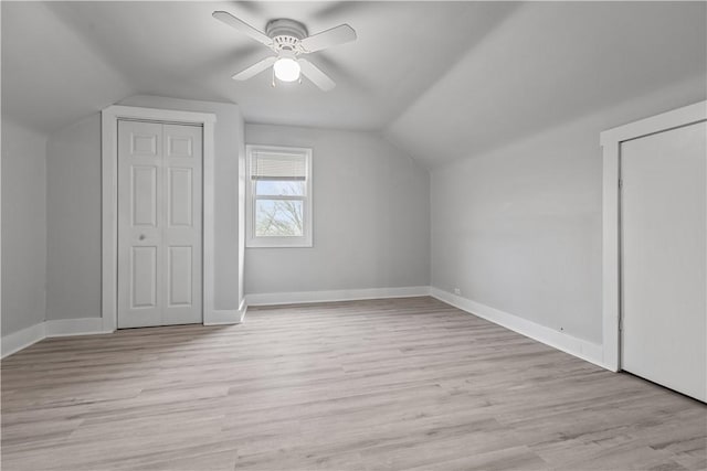 bonus room featuring light wood-type flooring, vaulted ceiling, and ceiling fan