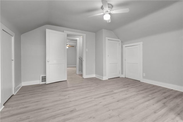 bonus room with ceiling fan, lofted ceiling, and light wood-type flooring