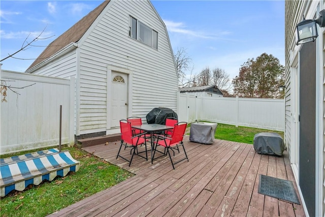 wooden deck with grilling area