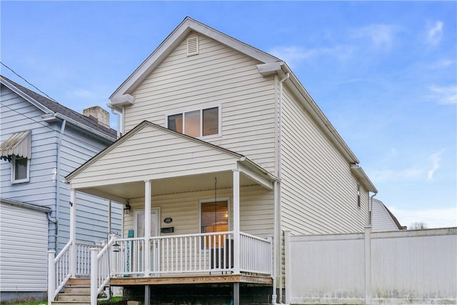 back of property featuring a porch