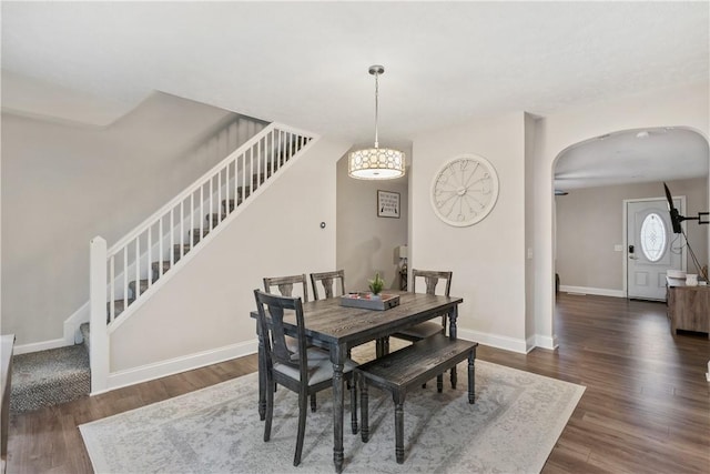 dining space featuring dark hardwood / wood-style floors