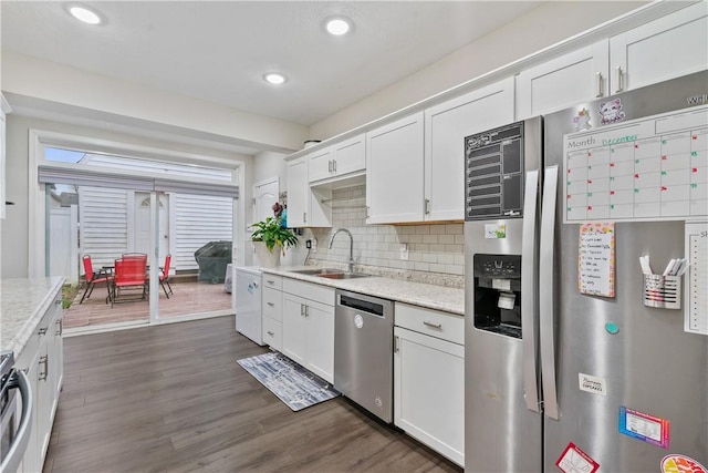 kitchen featuring white cabinetry, dark hardwood / wood-style flooring, stainless steel appliances, and sink