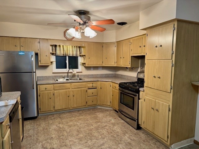 kitchen with appliances with stainless steel finishes, ceiling fan, and sink