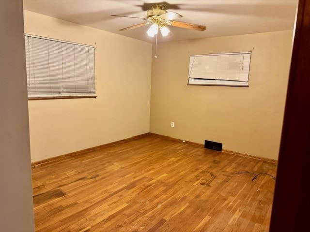 unfurnished room with light hardwood / wood-style flooring and ceiling fan