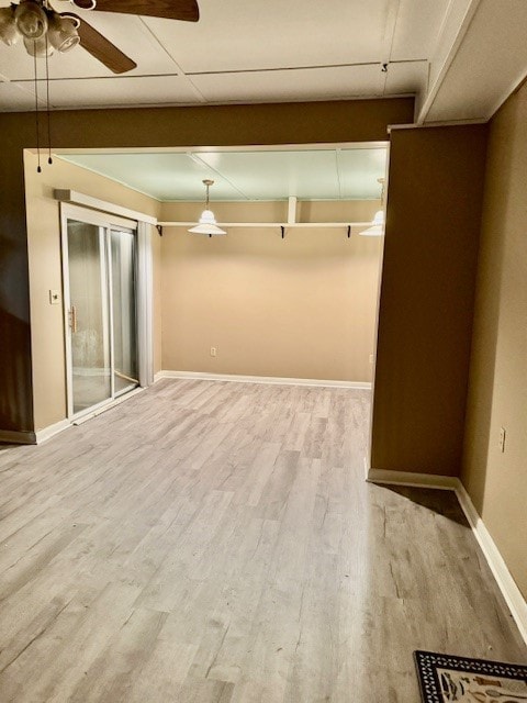 empty room featuring ceiling fan and light hardwood / wood-style floors