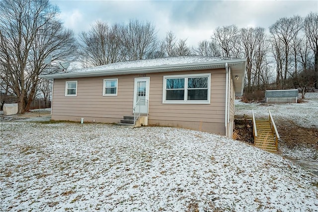 view of snow covered house