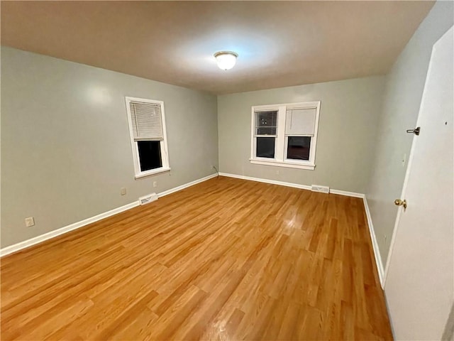 unfurnished room featuring light hardwood / wood-style floors