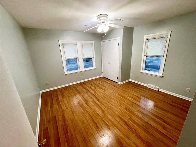 unfurnished room featuring ceiling fan and light hardwood / wood-style flooring