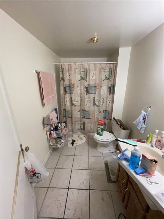 bathroom featuring tile patterned floors and toilet