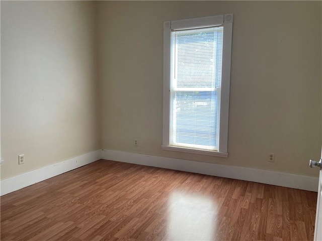 spare room featuring light wood-type flooring