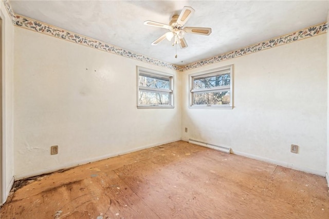 empty room featuring ceiling fan and a baseboard heating unit