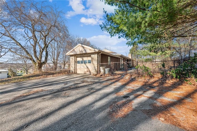 view of side of property featuring a garage