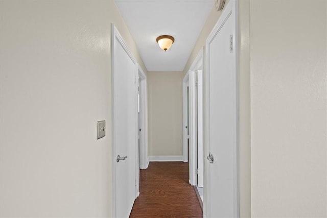 hallway featuring dark wood-type flooring