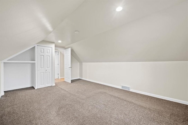 bonus room with carpet and lofted ceiling