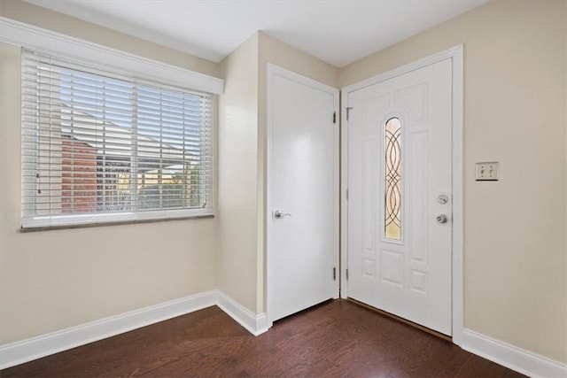 foyer entrance with dark hardwood / wood-style floors