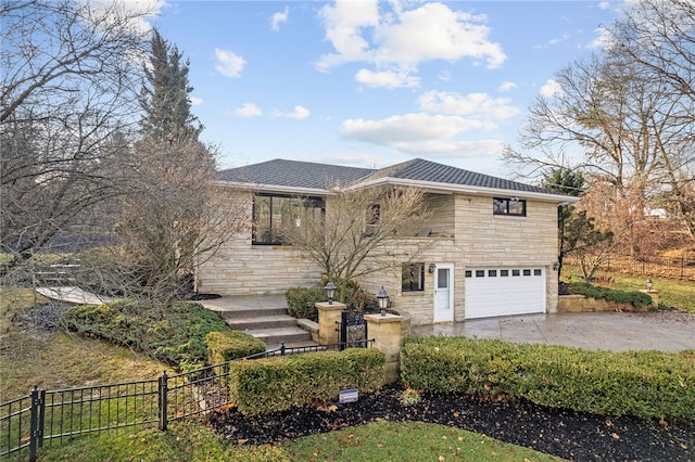 view of front of property featuring a garage