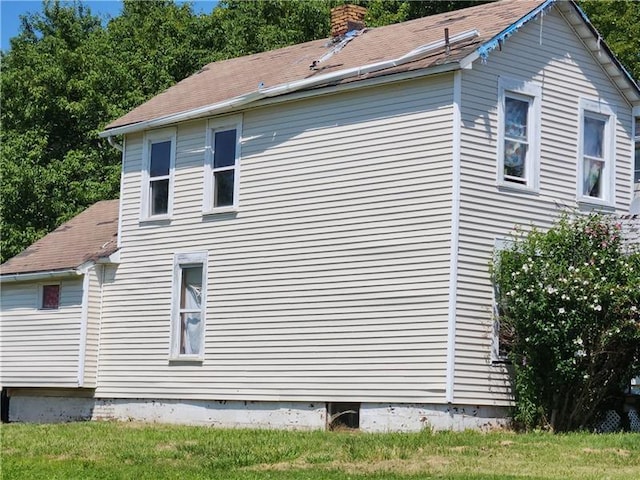 view of home's exterior featuring a lawn