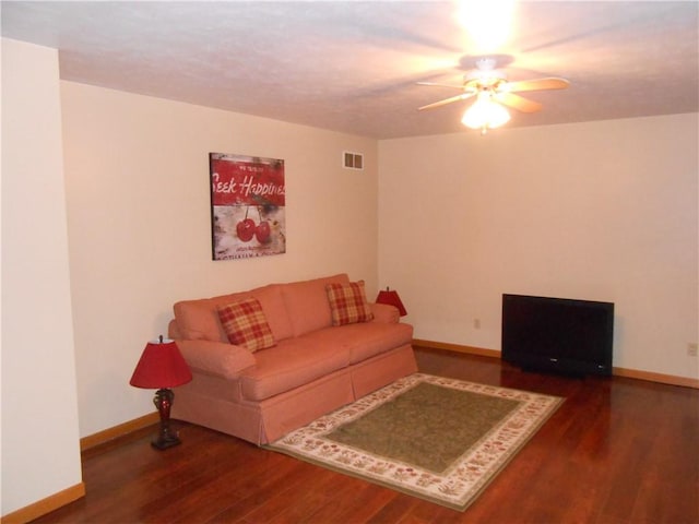 living room with hardwood / wood-style floors and ceiling fan