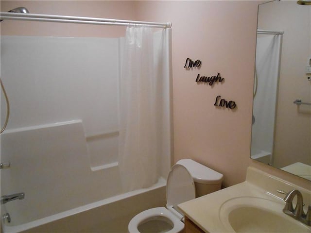 full bathroom featuring vanity, toilet, and shower / tub combo