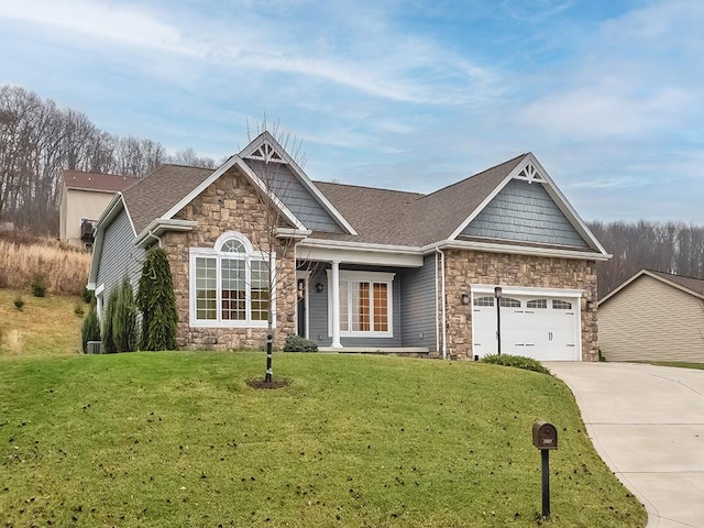 view of front of house featuring a front yard and a garage