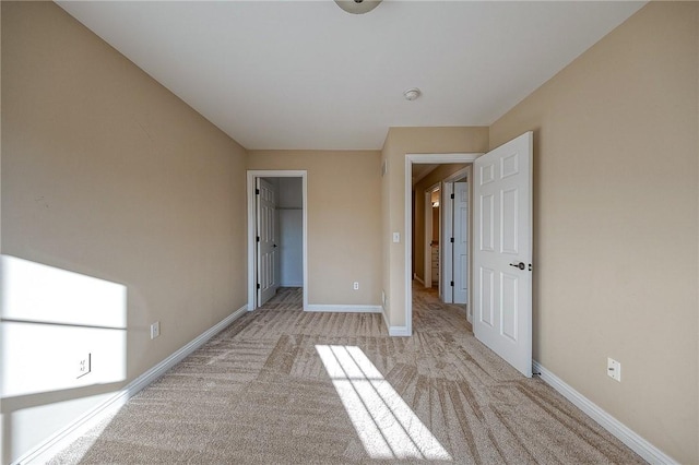 unfurnished bedroom featuring light colored carpet