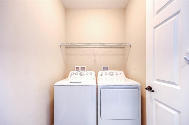 washroom with washer and clothes dryer