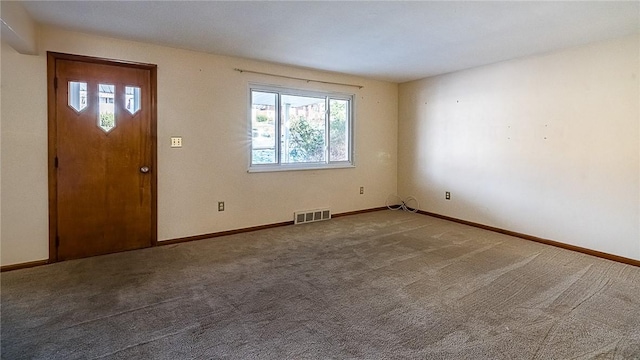 foyer entrance with carpet