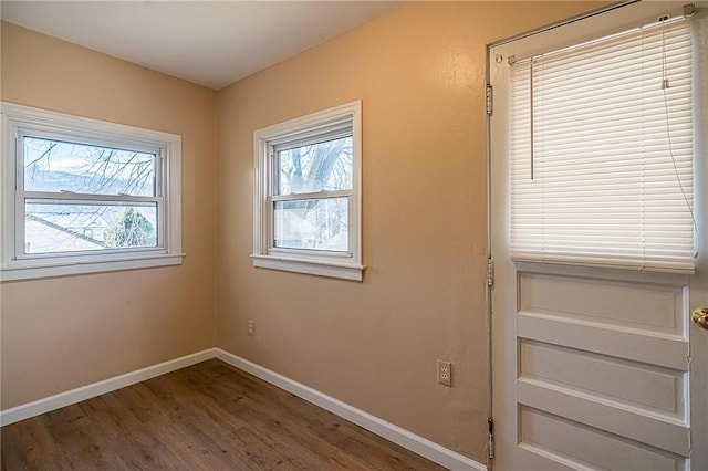 spare room featuring hardwood / wood-style floors