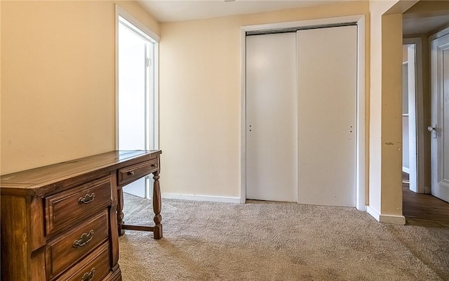 corridor featuring carpet flooring