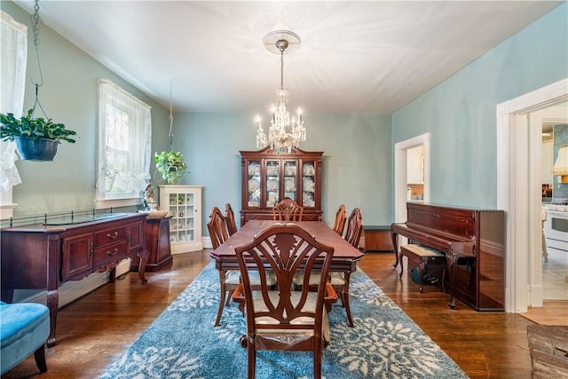 dining space featuring a chandelier and dark hardwood / wood-style floors