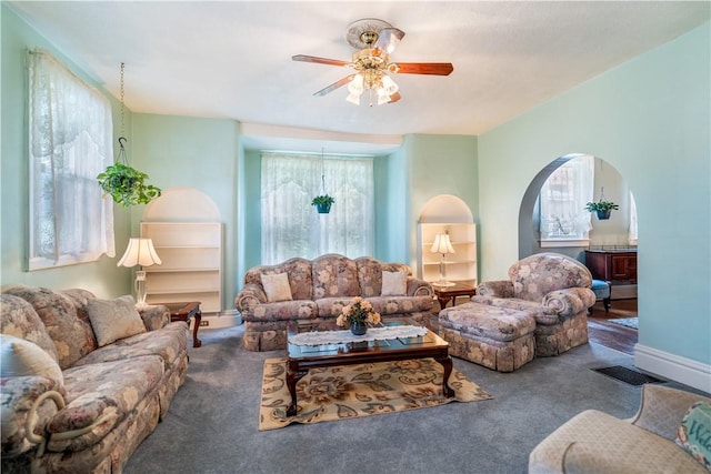 living room featuring ceiling fan and carpet floors