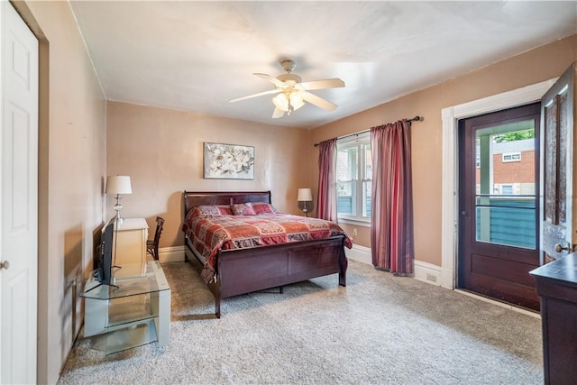 bedroom with carpet floors, multiple windows, and ceiling fan