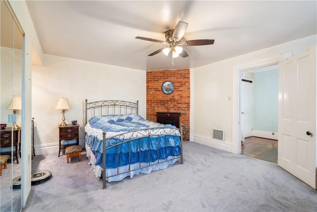 bedroom featuring ceiling fan, carpet floors, and a baseboard radiator