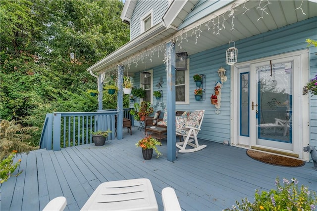 wooden terrace featuring covered porch