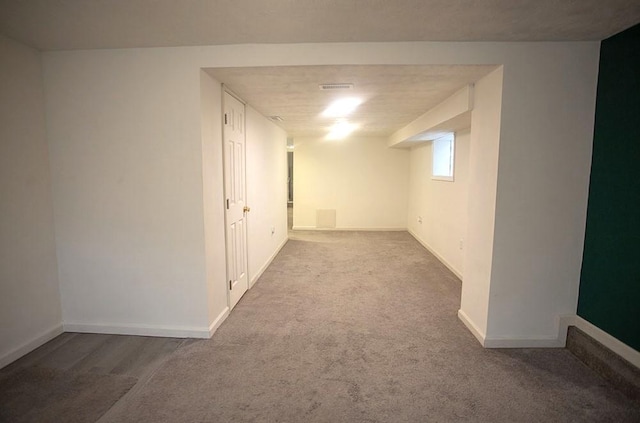 basement featuring carpet flooring