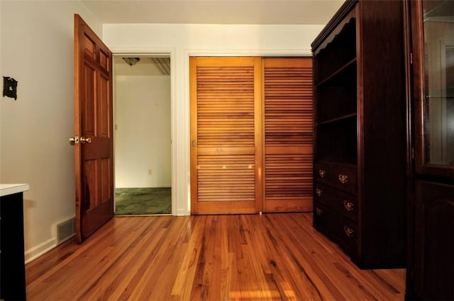 unfurnished bedroom featuring wood-type flooring