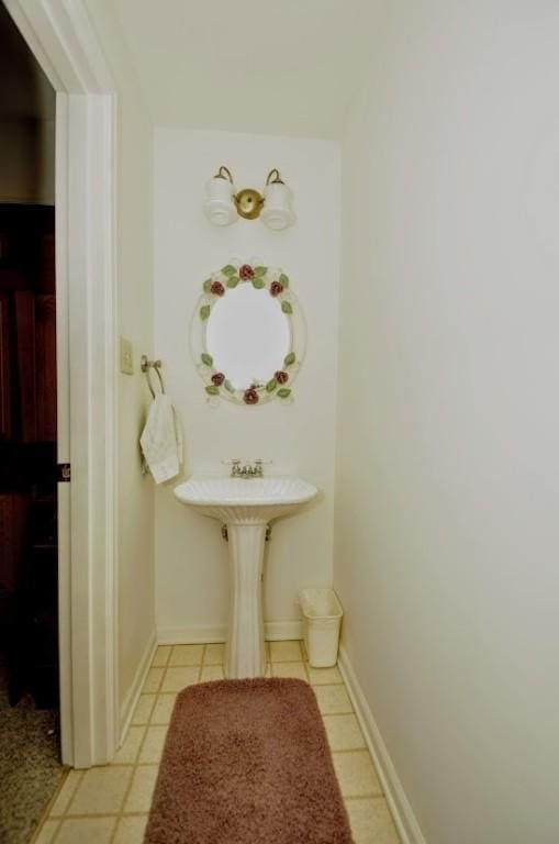 bathroom with tile patterned floors