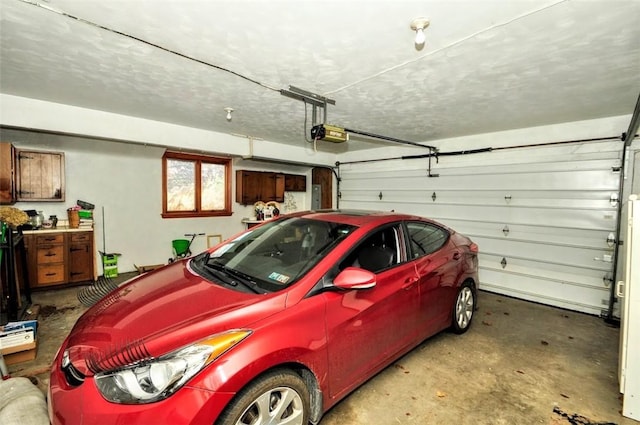 garage featuring a garage door opener