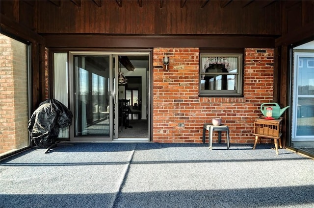 entrance to property featuring a patio