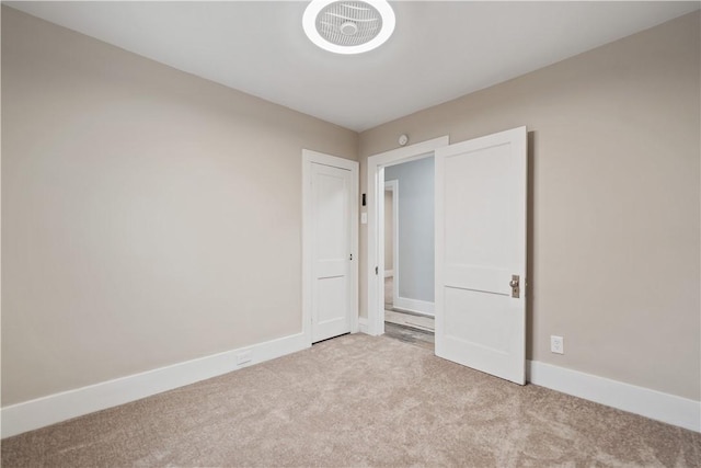 unfurnished bedroom with light carpet