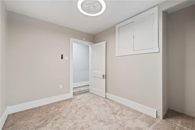 empty room with light colored carpet