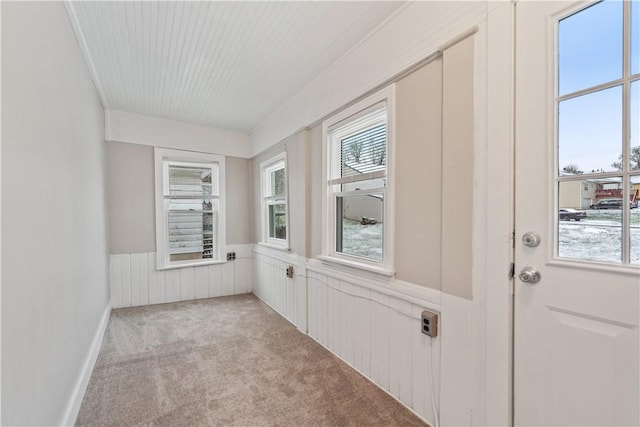 interior space with light colored carpet and crown molding