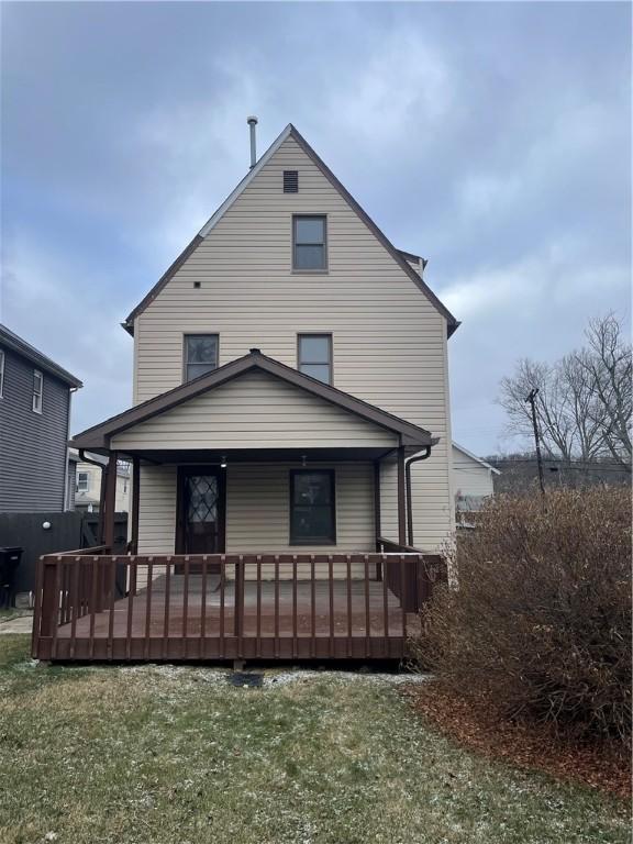 rear view of house with a lawn