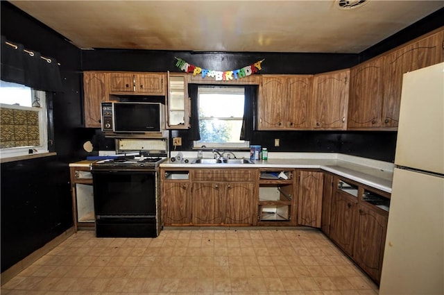 kitchen featuring sink and black appliances