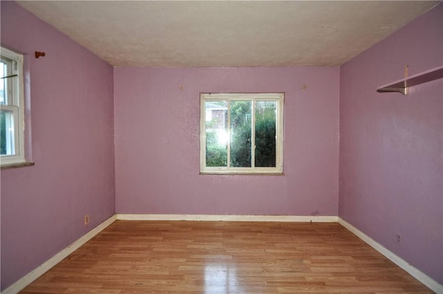 spare room with light hardwood / wood-style floors