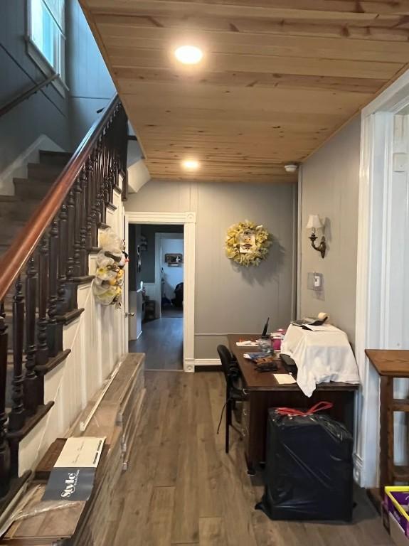 interior space featuring hardwood / wood-style floors and wood ceiling