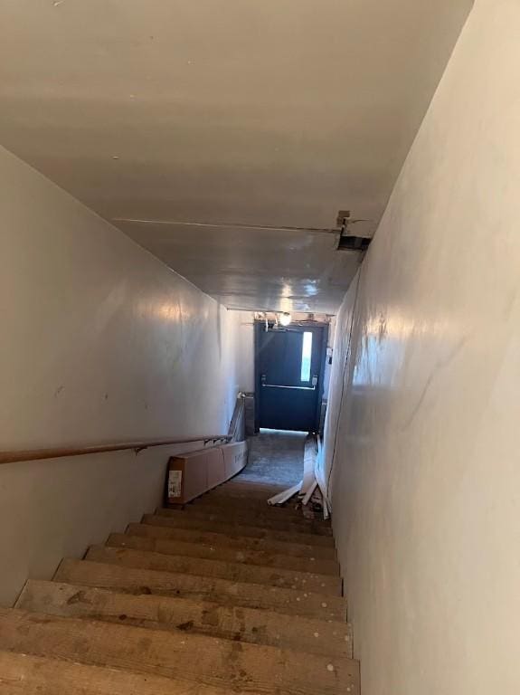 stairway featuring hardwood / wood-style flooring