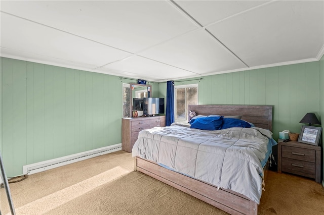 bedroom with carpet flooring, baseboard heating, and wood walls