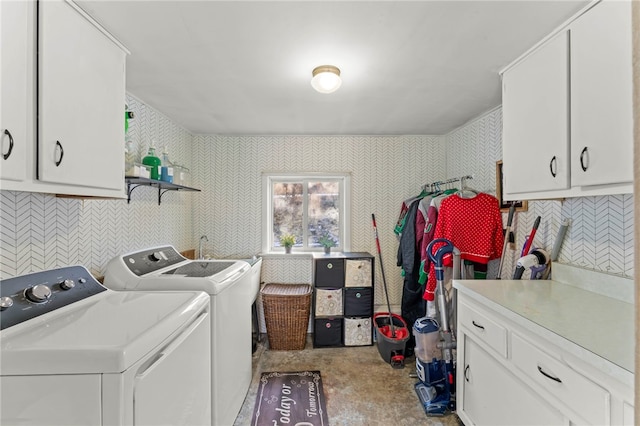 laundry area with cabinets and independent washer and dryer